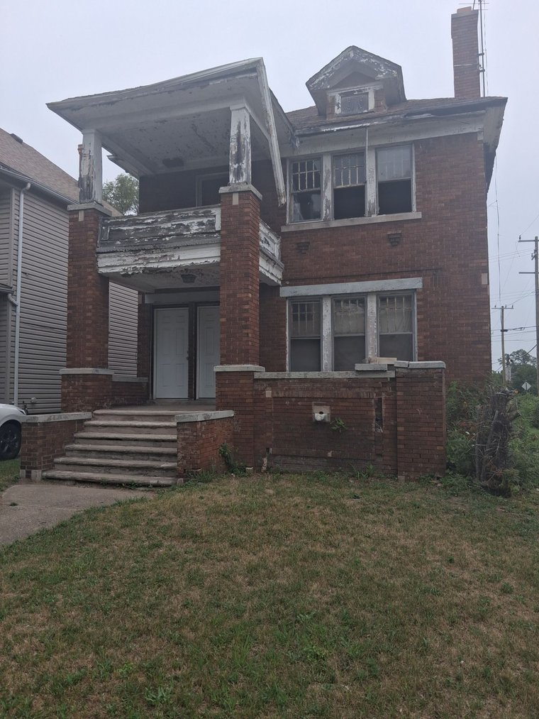Detroit home before renovation — vacant and distressed